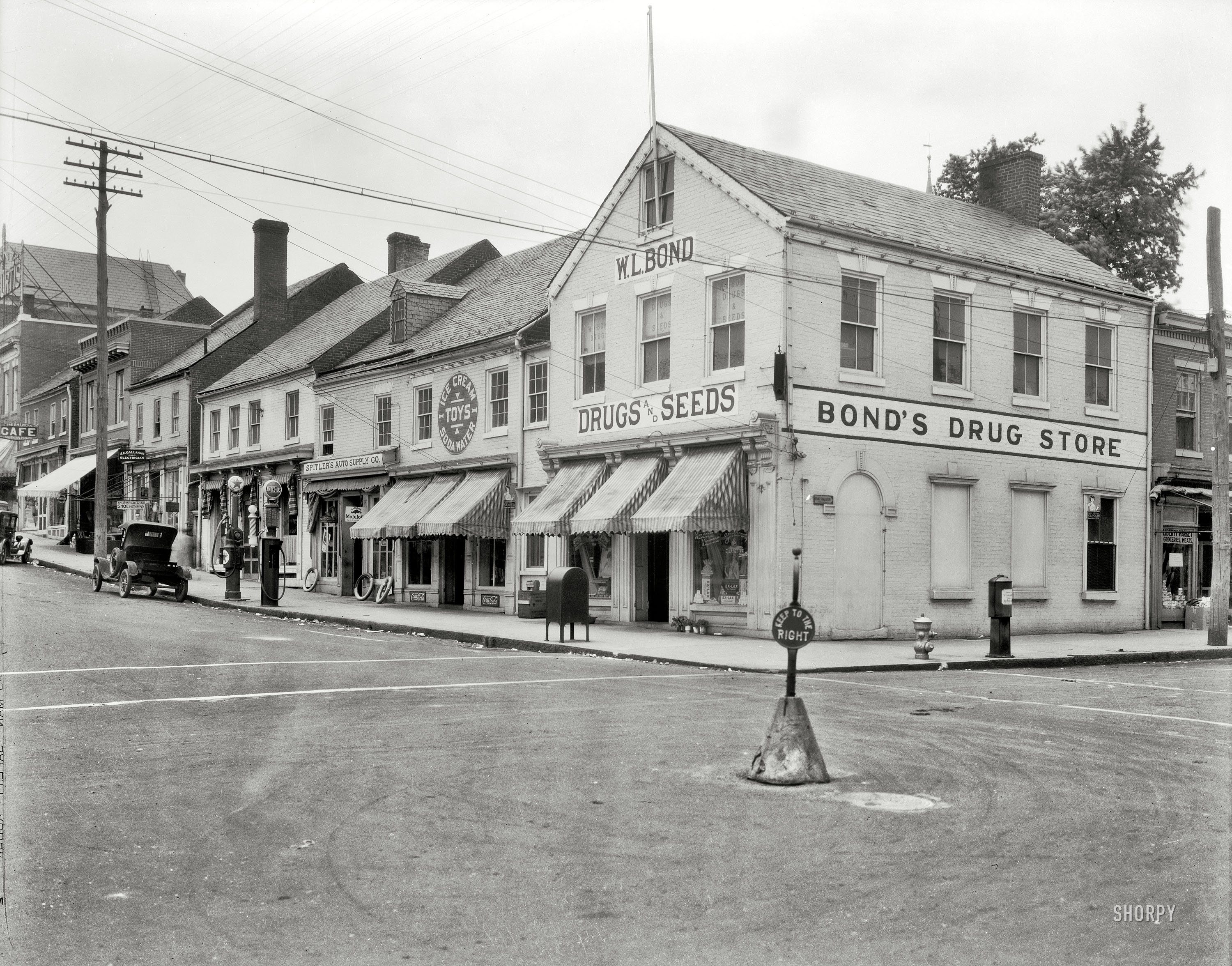 Fredericksburg, Virginia, circa 1928. "Merchants' stores and offices, brick row, Commerce and Main Streets. Photograph taken on commission from Mrs. Devore of Chatham." Acetate negative by Frances Benjamin Johnston. View full size.