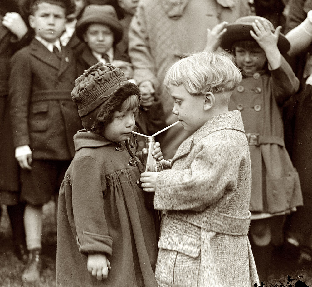 "Fifty-fifty - something better than rolling Easter eggs." Sharing a drink at the White House Easter-egg roll in 1922. View full size. National Photo Co.