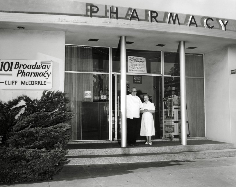 I purchased this 8 x 10 print at the swap meet. On the back is printed:
Mr. and Mrs. Cliff McCorkle at their pharmacy, 101 Broadway, Richmond, Calif. 5 November 1957. Photographer: Pfc. Barbara A. Warner, Sixth US Army Photo Lab, Presidio of San Francisco, Calif. Official US Army photograph. View full size.
