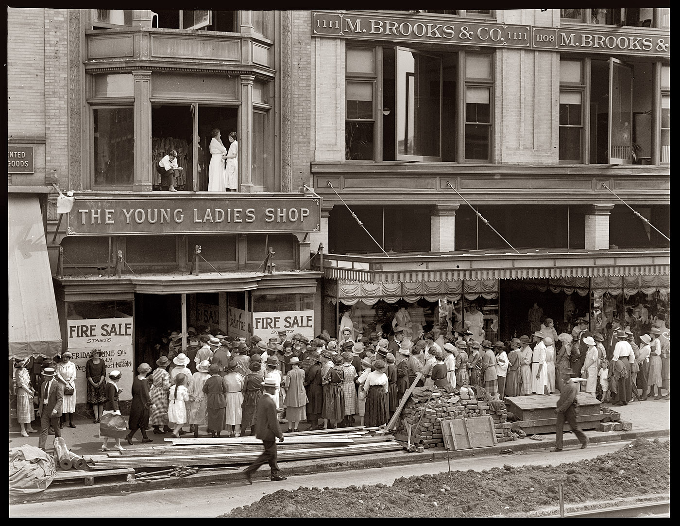 Fire sale at the Young Ladies Shop in 1922, probably in Washington, D.C. 4x5 inch glass negative, National Photo Company Collection. View full size.