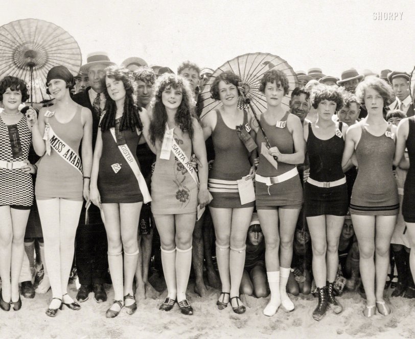 The West Coast has the sunshine
And the girls all get so tanned ... 
Huntington Beach, California. "Bathing Beauty Pageant, 1925." Three-panel gelatin silver print by Miles F. Weaver (1879-1932). View full panorama.
