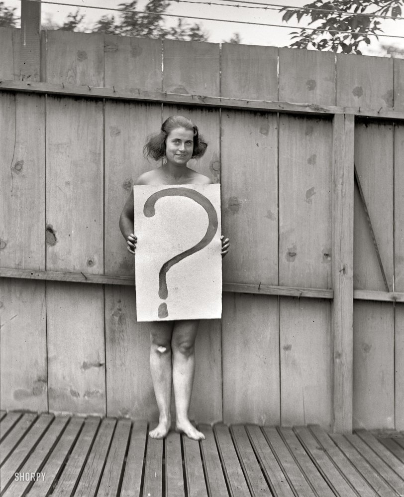 July 28, 1922. Washington, D.C. "Unclothed woman behind '?' sign." That pretty well sums it up. National Photo Co. Collection glass negative. View full size.
