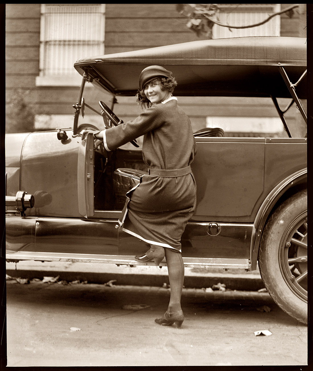 Miss Laura Bryn, daughter of the Norway's ambassador to Washington, gets into her car on November 2, 1922. View full size. National Photo Co. Collection.