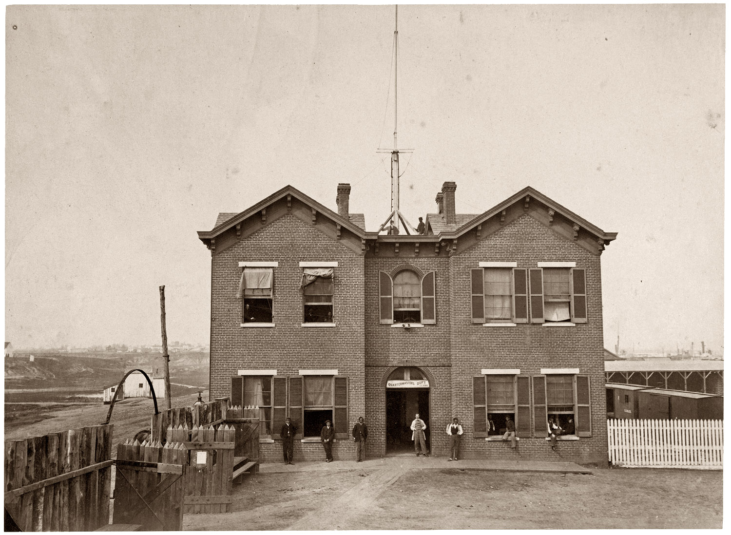 U.S. Army Quartermaster's Department, Alexandria, Virginia. View full size. Albumen print from a photograph by Andrew J. Russell taken during the Civil War (1861-1865). Note the elaborate signal mast on the roof.