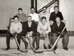 The Princeton hockey team circa 1910. View full size. G.G. Bain Collection.
PrincetonTough looking dudes.  Very cool team logo.
Wow!That guy in the middle is awesome. I love the interesting faces that always pop up in these old photos.
Hmmm...No helmets, few pads and they all seemed to have most of their teeth.  Was hockey that much genteel back then?
Hobey Baker?Isn't the player second from the left the great Hobey Baker? He is probably the most famous amateur player of his time and had his life not been cut short during WWI there may have been a greater legacy left behind. The Hobey Baker Award keeps his name and legend alive.
[Hobey (below) isn't in this photo. - Dave]

(The Gallery, G.G. Bain, Sports)