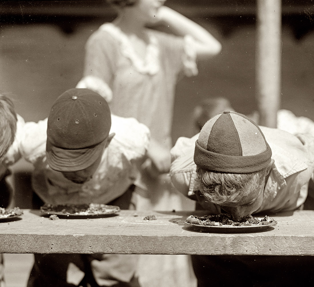 "Pie eating contest, Jefferson school, 8/2/23." Still more pie-eating in Washingon, D.C. National Photo Company Collection glass negative. View full size.