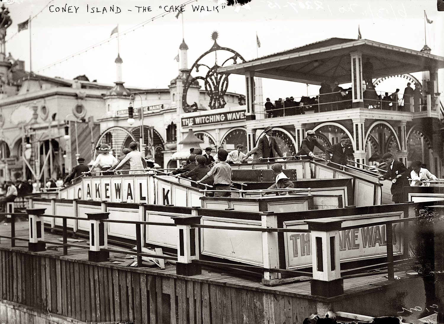 June 13, 1911. The Cake Walk at Luna Park on Coney Island. View full size. 5x7 glass negative, George Grantham Bain Collection. Who can describe this ride?