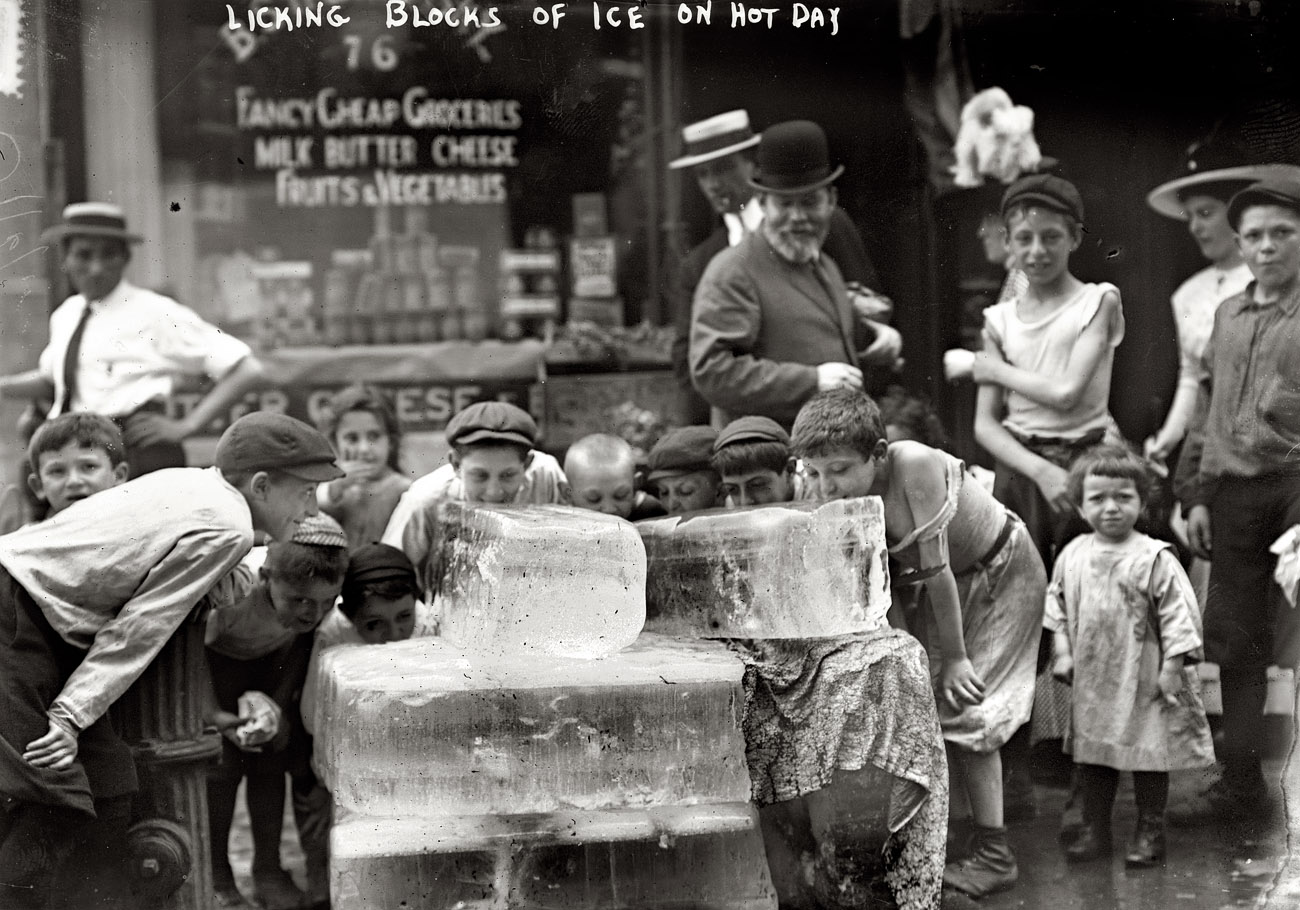 Heat wave in New York. July 6, 1911. "Licking blocks of ice on a hot day." 5x7 glass negative, George Grantham Bain Collection. View full size.
