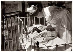 Nurse and patient "Sea Breeze Jr." circa 1915. View full size. George Grantham Bain Collection. Probably taken at one of New York's seaside "cottage" hospitals for babies, where plenty of fresh air and sunshine were believed to be therapeutic.
Sea Breeze Jr.I hope the therapy worked...
(The Gallery, G.G. Bain, Kids)