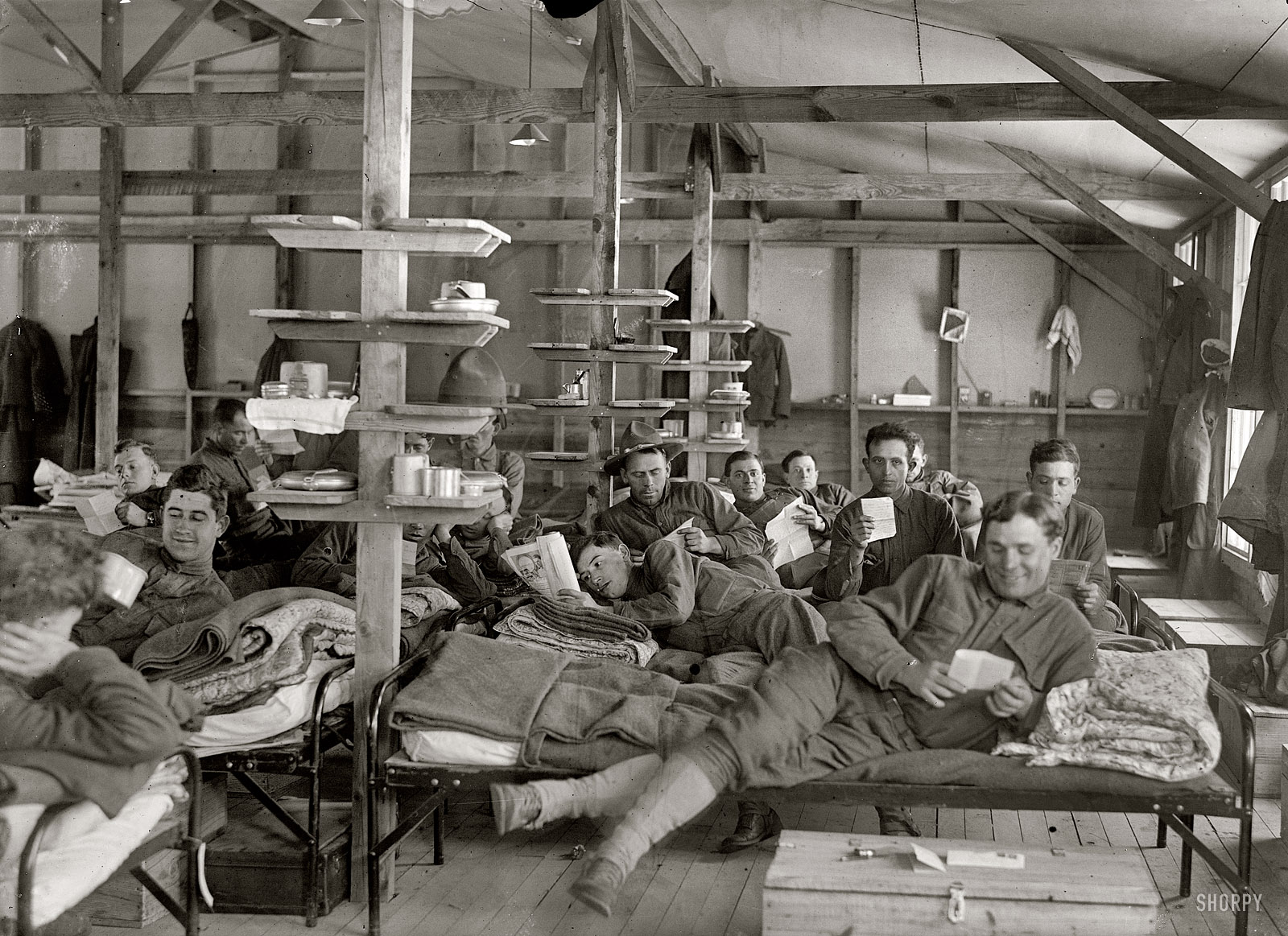 "1917. Camp Meade, Maryland. Winter views." At ease in the barracks with news from the folks. Harris & Ewing Collection glass negative. View full size.