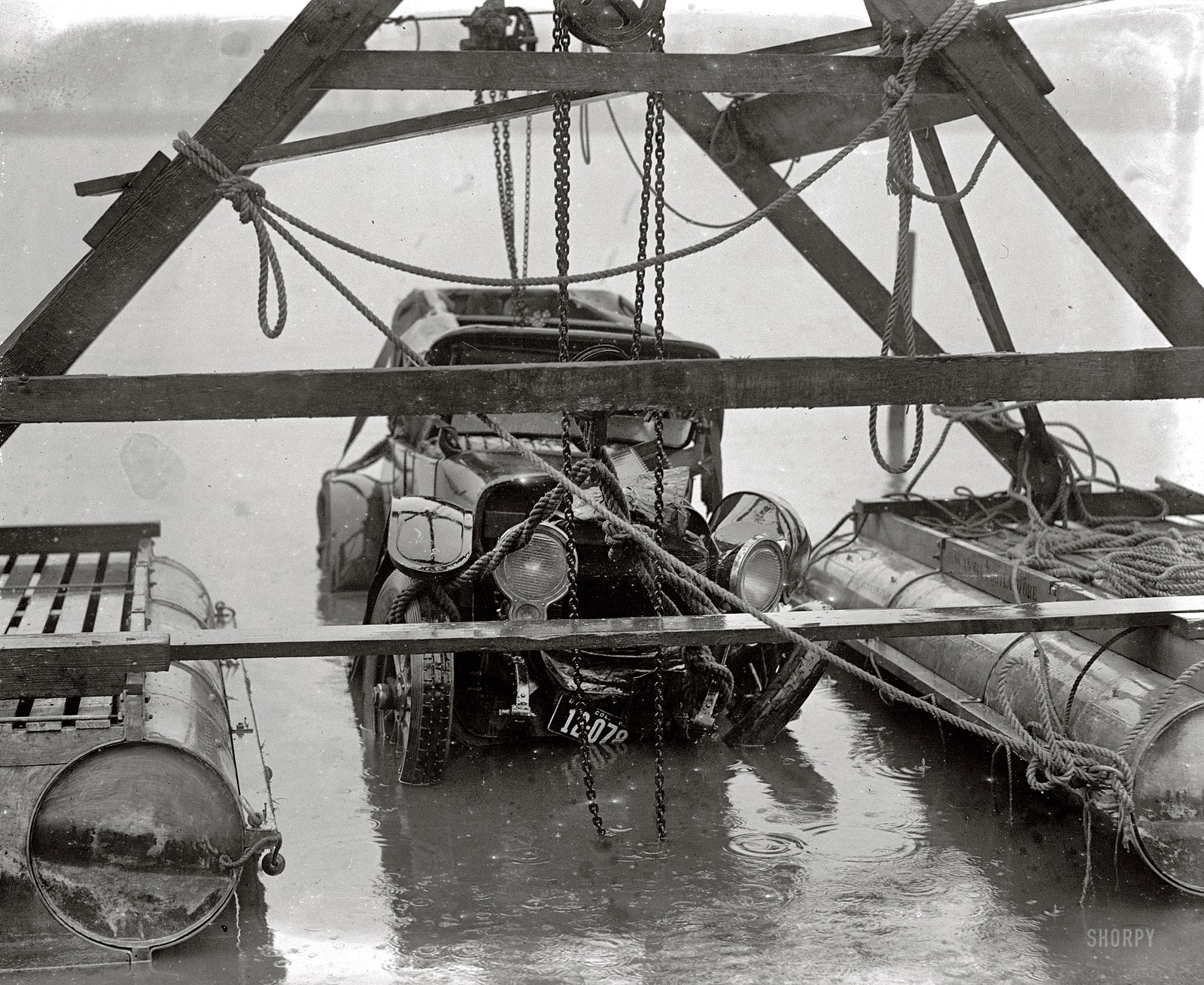 "Auto wreck. December 31, 1923." Continuing this week's theme of vehicular mishaps on (and off) the roads of Washington, D.C. On New Year's Eve, this car was in the drink. See the comments for details about this fatal accident in the Tidal Basin. National Photo Company Collection glass negative. View full size.