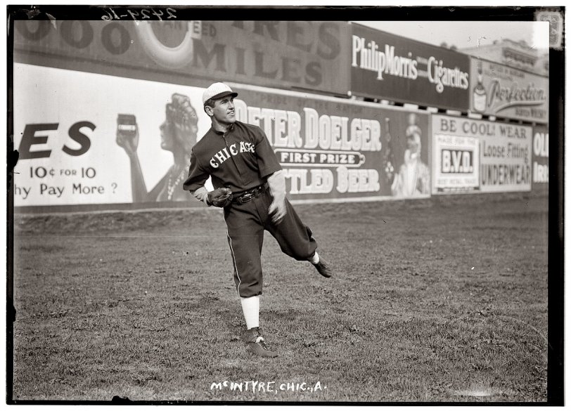 Photo of: How to Be Cool: 1912 -- Matty McIntyre of the Chicago White Sox against a backdrop of sales pitches in 1912. View full size. George Grantham Bain Collection.