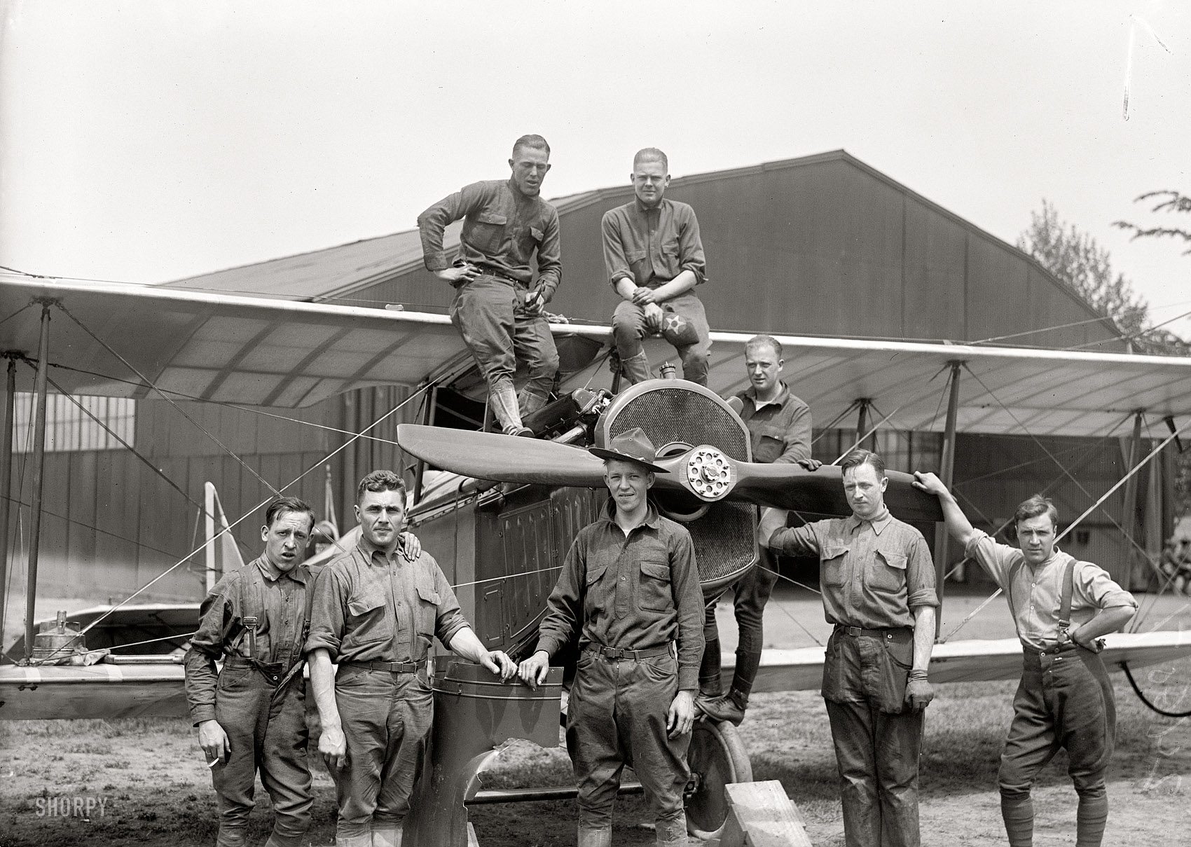 "Inauguration of Aero Mail service. Polo Field mechanics." On May 15, 1918, "America's first aerial mail service was put into operation when aeroplanes piloted by Army aviators carried consignments of mail from New York and Philadelphia to Washington, and from Philadelphia to New York." View full size.