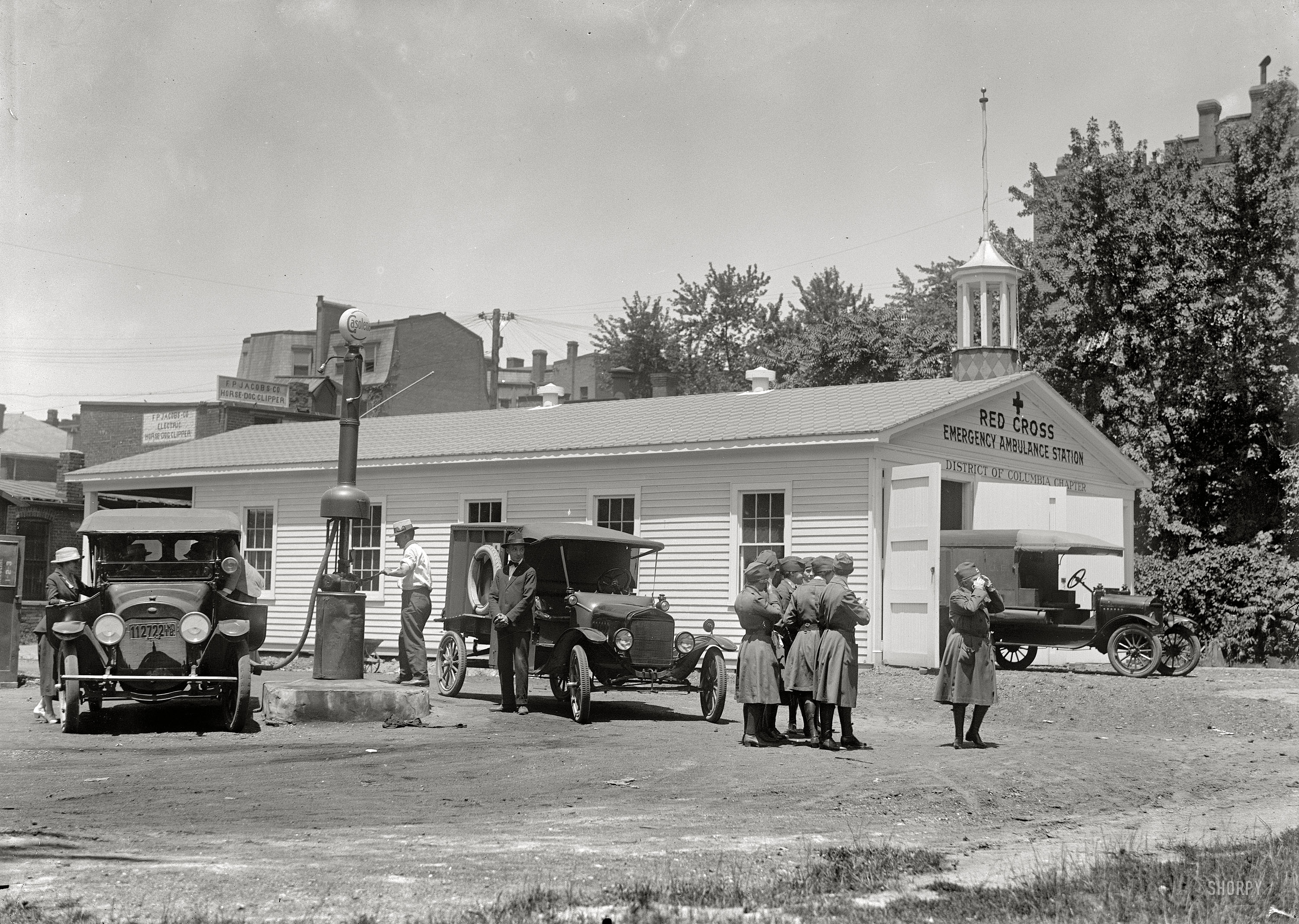 1917. Washington, D.C. "Red Cross emergency ambulance station garage, 16th Street," conveniently next door to F.P. Jacobs, "electric horse-dog clipper."  Harris & Ewing Collection glass negative, Library of Congress. View full size.