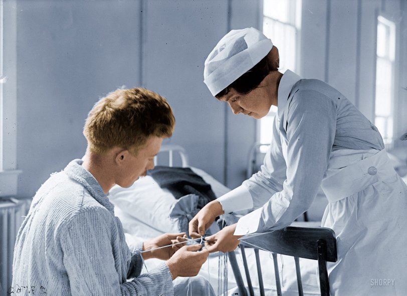 Colorized version of  String Theory: 1918.  I think this was therapy for shell shocked soldiers in World War I. It looks like this picture shows the moment when the therapy was working. View full size.
