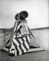 Washington, D.C., August 1918. "Angelus siren on roof of Evans building." Every day at noon, Get Behind the Government and Pray for Victory. View full size.