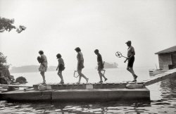 July 1957. "The Whites on the bridge between Watch Island and Rum Point for morning tennis." View full size. Gelatin silver print by Toni Frissell.