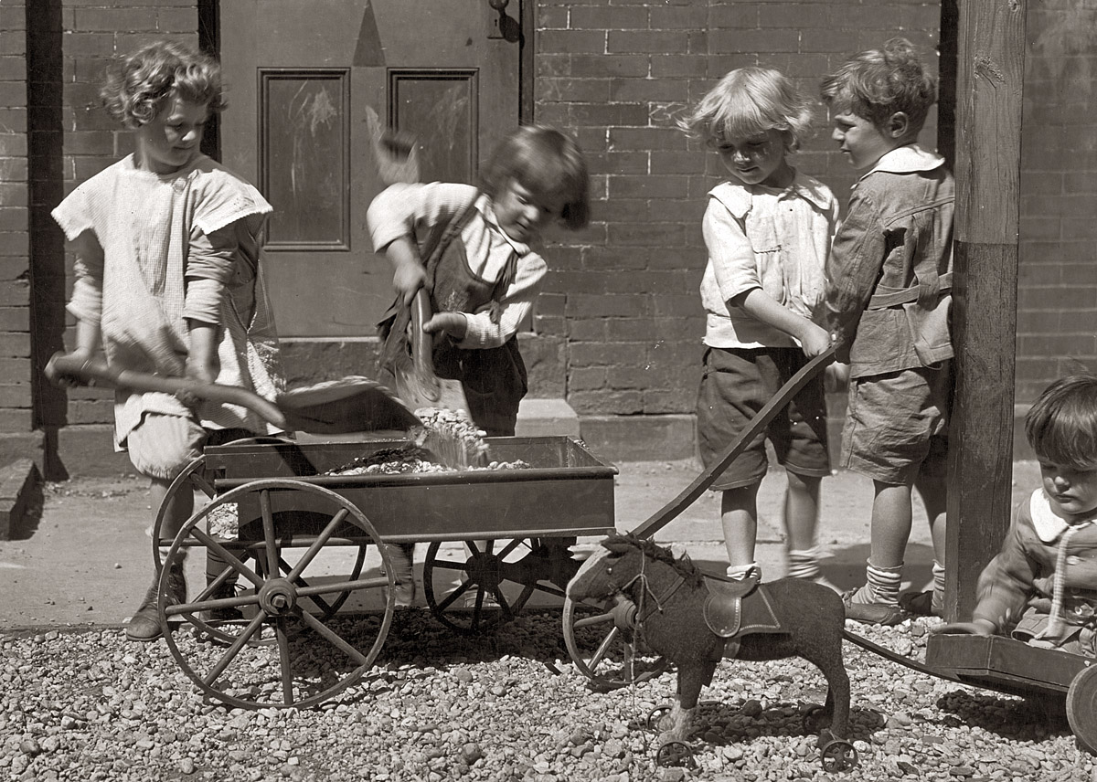 Children at play circa 1920 as captured by the pioneering news photographer and society portraitist Jessie Tarbox Beals (1870-1942). View full size. In 2000 the New York Times reviewed a retrospective of her work: "One of the reasons so few women entered the profession was that equipment was so heavy. Beals carried an 8-by-10 view camera, glass plates and a tripod, close to 50 pounds of paraphernalia. (She was further encumbered by a whalebone corset and a hat the size of a flying saucer.) Still, when a judge in a murder trial locked the photographers out, she climbed a tall bookcase up to a transom window, snapped a picture before she was detected and had a five-column front-page photograph."