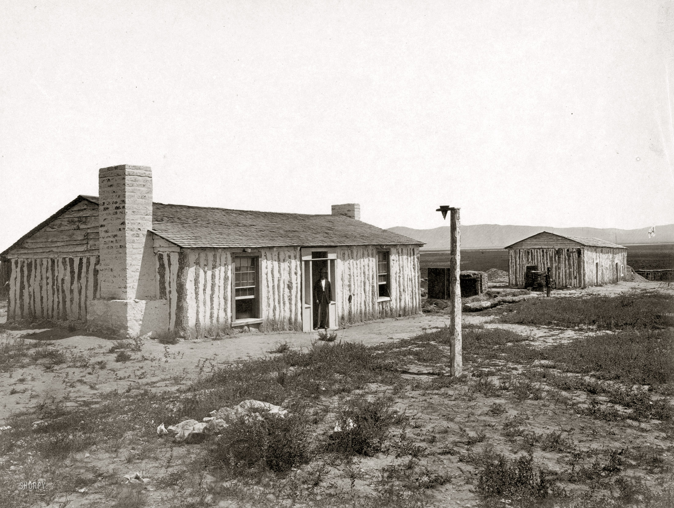 1868. "Fort Ruby, Nevada. Photo showing two houses." Plate 112 from Geological Exploration of the Fortieth Parallel, Army Corps of Engineers. Clarence King, geologist in charge. Albumen print by Timothy H. O'Sullivan. View full size.