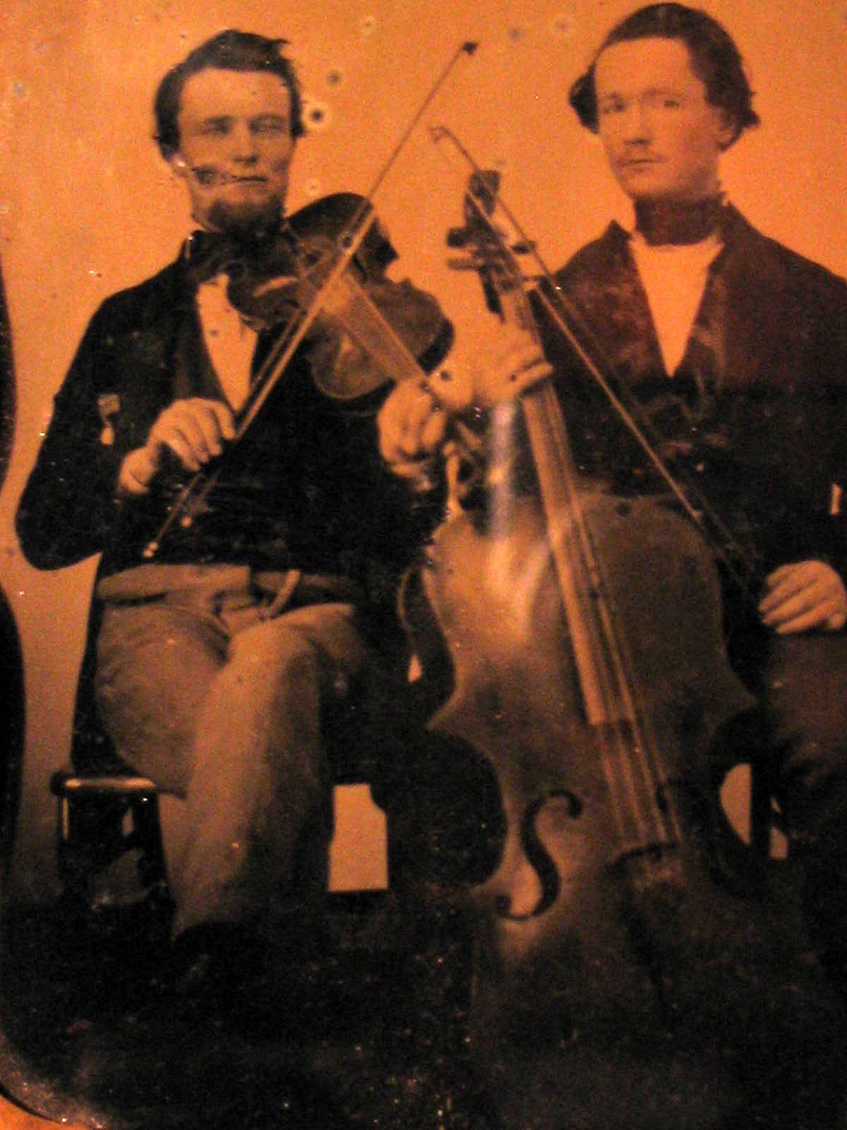 Ambrotype of my great-great-great-uncles, Ephraim R. Jones and John Quincy Adams Jones, about 1858-1860 in Illinois. I am descended from their brother, Martin Van Buren Jones, who went to northern California via the Oregon trail in 1852. Ephraim was an early-day portrait photographer (Jones and Hover Studio, Jacksonville, Illinois) and was, according to family lore, for a while a traveling fiddler and dancing master. He came to the northern California coast town of Crescent City to visit Martin and his family and probably brought this and my other Jones family ambrotypes with him, and I have inherited them. John Quincy Adams Jones was a young lawyer in Havana, Illinois with a promising career ahead of him when he enlisted as a Lieutenant in Company K, 17th Regiment, Illinois Volunteer Infantry in 1861, and was killed in the battle of Fredericktown, Missouri on Oct. 24, 1861. View full size.