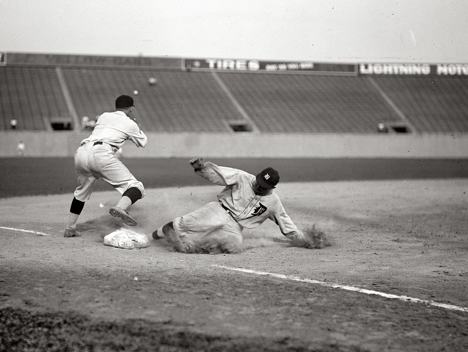 Aug. 16, 1924, at Griffith Stadium in Washington. "Nationals and Tigers. Ty Cobb safe at third after making a triple." View full size. National Photo glass negative.