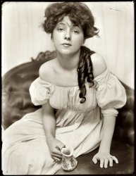 New York circa 1901. "Evelyn Nesbit, age 16, brought to the studio by Stanford White." A chorus girl turned artists' model, Evelyn Nesbit was at the center of a huge scandal in 1906 when her husband killed her former lover, the architect Stanford White. View full size. 8x10 glass negative by Gertrude Käsebier.