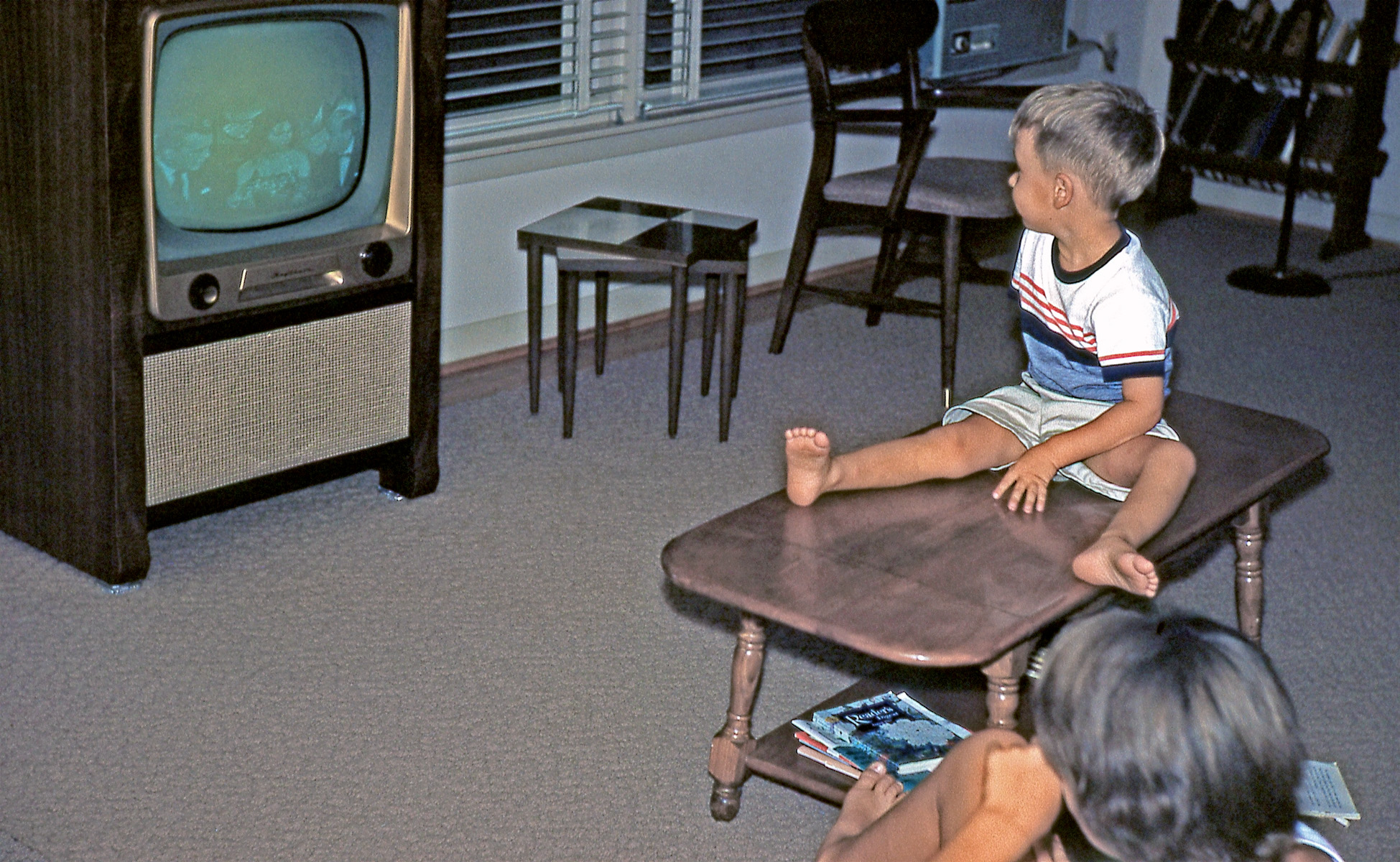 My sister and me watching TV; College Station, Texas, September, 1961. Sure wish I knew what it was we were watching. The ghostly image is tantalizing but probably not clear enough for a guess. View full size.