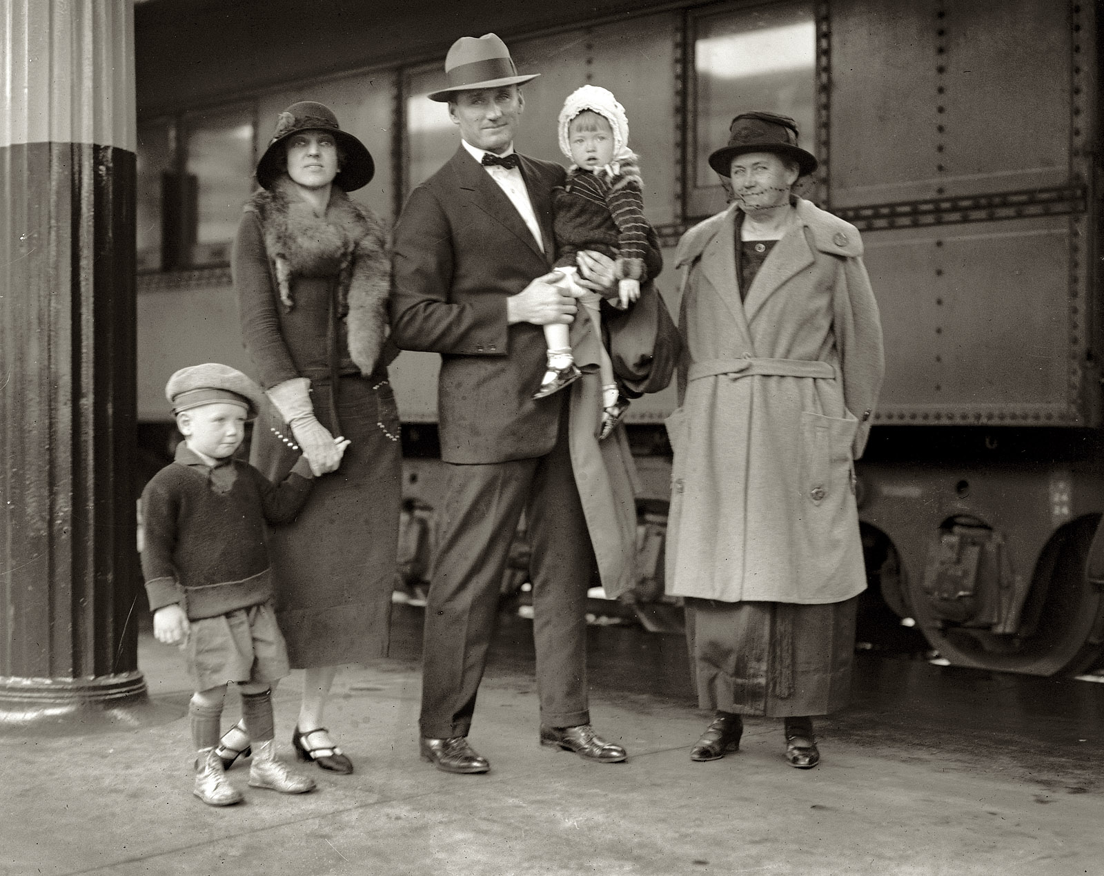 September 30, 1924. Washington Nationals pitcher Walter Johnson, aka "The Big Train," with his wife, mother and children at Union Station. View full size. National Photo Company collection glass negative, Library of Congress.