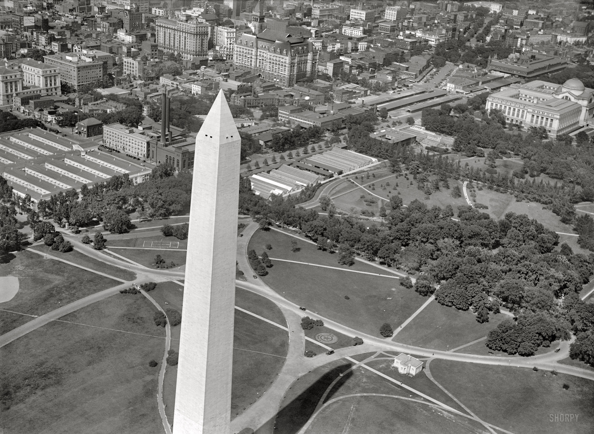 1919. "National Museum, air view from Washington Monument." The Smithsonian Institution's National Museum of Natural History (domed building at right) nine years after its completion. Harris & Ewing Collection. View full size.