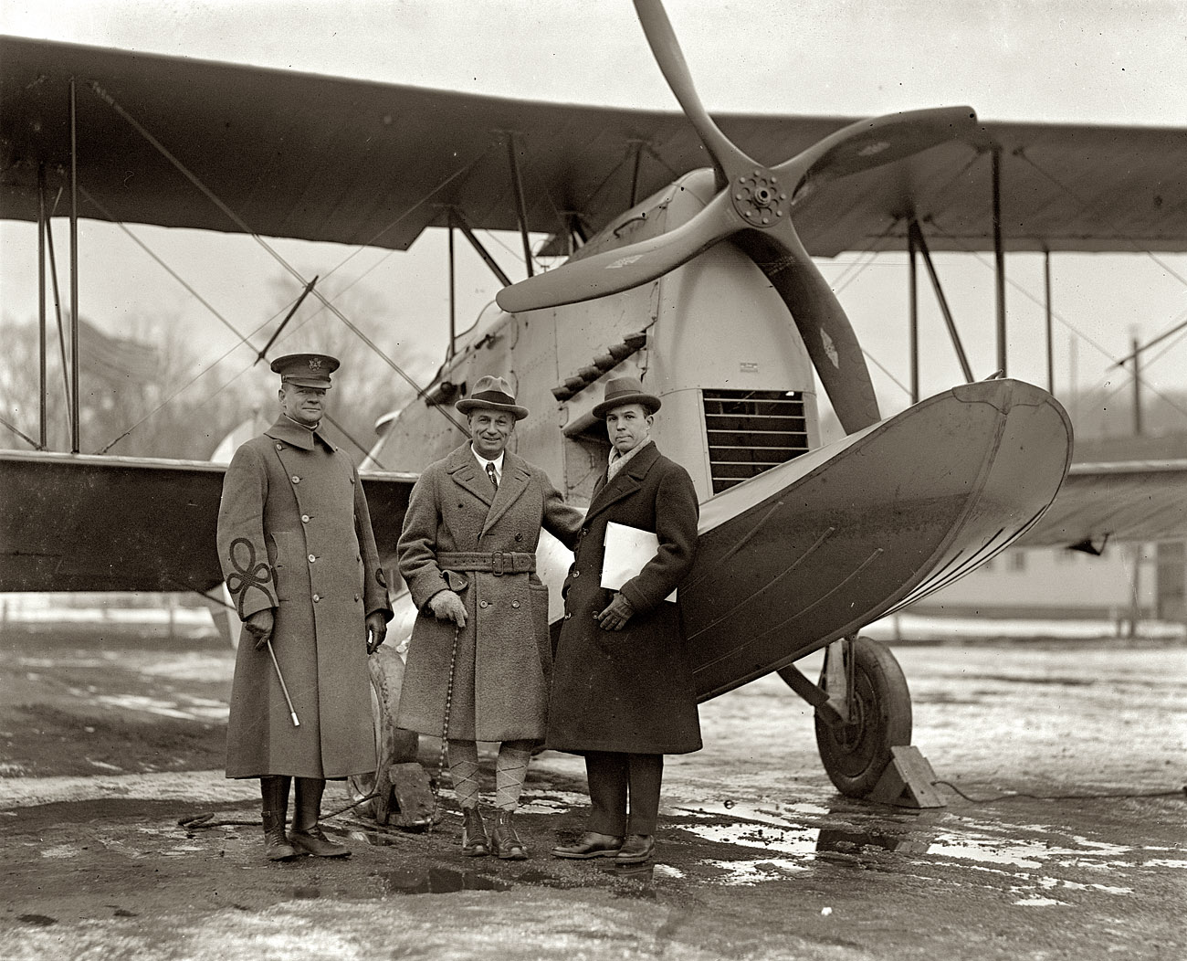 January 19, 1925. Loening amphibian plane. Maj. Henry Clagett, Gen. William Mitchell, Grover Loening at Bolling Field. View full size. National Photo Co.