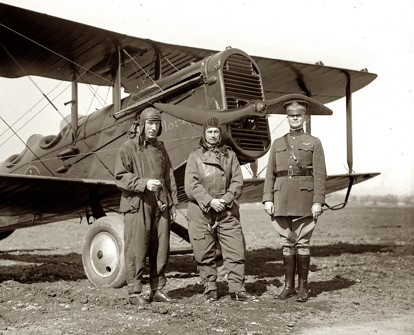 Feb. 20, 1925. Rep. P.B. O' Sullivan, Gen. Billy Mitchell and Maj. Henry B. Clagett with biplane ("Plover") at Bolling Field. View full size. National Photo Co.