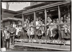 Children and adults take a "fresh air outing" on a trolley in June in Brooklyn, New York. View full size. 5x7 glass negative, George Grantham Bain Collection.