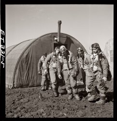Tuskegee airmen exiting the parachute room at Ramitelli, Italy. March 1945. From left: Richard S. "Rip" Harder, Brooklyn, Class 44-B; unidentified airman; Thurston L. Gaines Jr., Freeport, N.Y., Class 44-G; Newman C. Golden, Cincinnati, Class 44-G; Wendell M. Lucas, Fairmont Heights, Maryland, Class 44-E. View full size. Photograph by Toni Frissell.