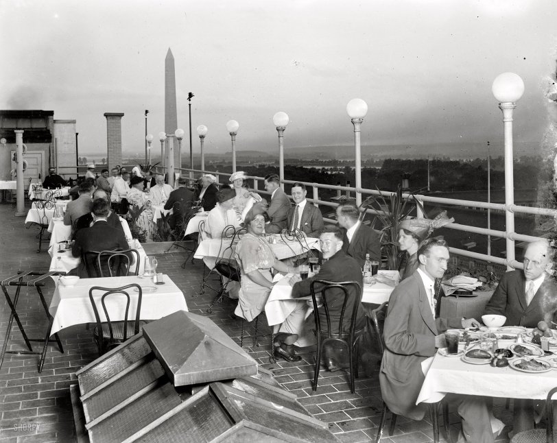 "No caption." Rooftop dining somewhere near the Washington Monument circa 1920. Harris &amp; Ewing Collection glass negative. View full size.
