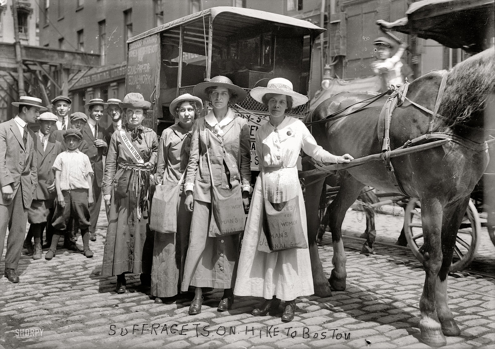 New York, August 1913. "Suffragettes on hike to Boston." Our third look at the suffrage caravan. On the right in white is Elizabeth Freeman, probably with her fellow suffragist travelers Elsie MacKenzie and Vera Wentworth. The lady with the sash might be Elizabeth Worth Mueller, their chaperon. The horse, if it's the same one who conveyed Elizabeth on a previous escapade, was a steed of artistic temperament (he liked sunsets and the color yellow) named Lausanne, who cost $59.98. 5x7 glass negative, George Grantham Bain Collection. View full size.