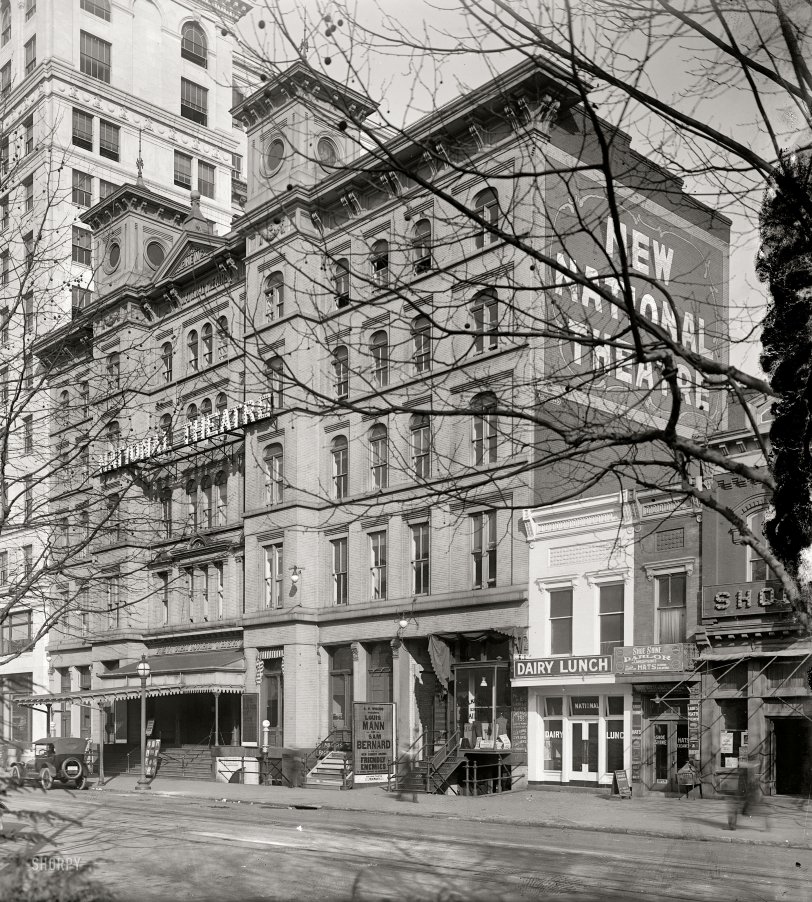 March 1918. The National Theatre on E Street. At right is Shoomaker's, a favorite Shorpy hangout. Harris &amp; Ewing glass negative. View full size.
