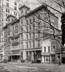 March 1918. The National Theatre on E Street. At right is Shoomaker's, a favorite Shorpy hangout. Harris & Ewing glass negative. View full size.