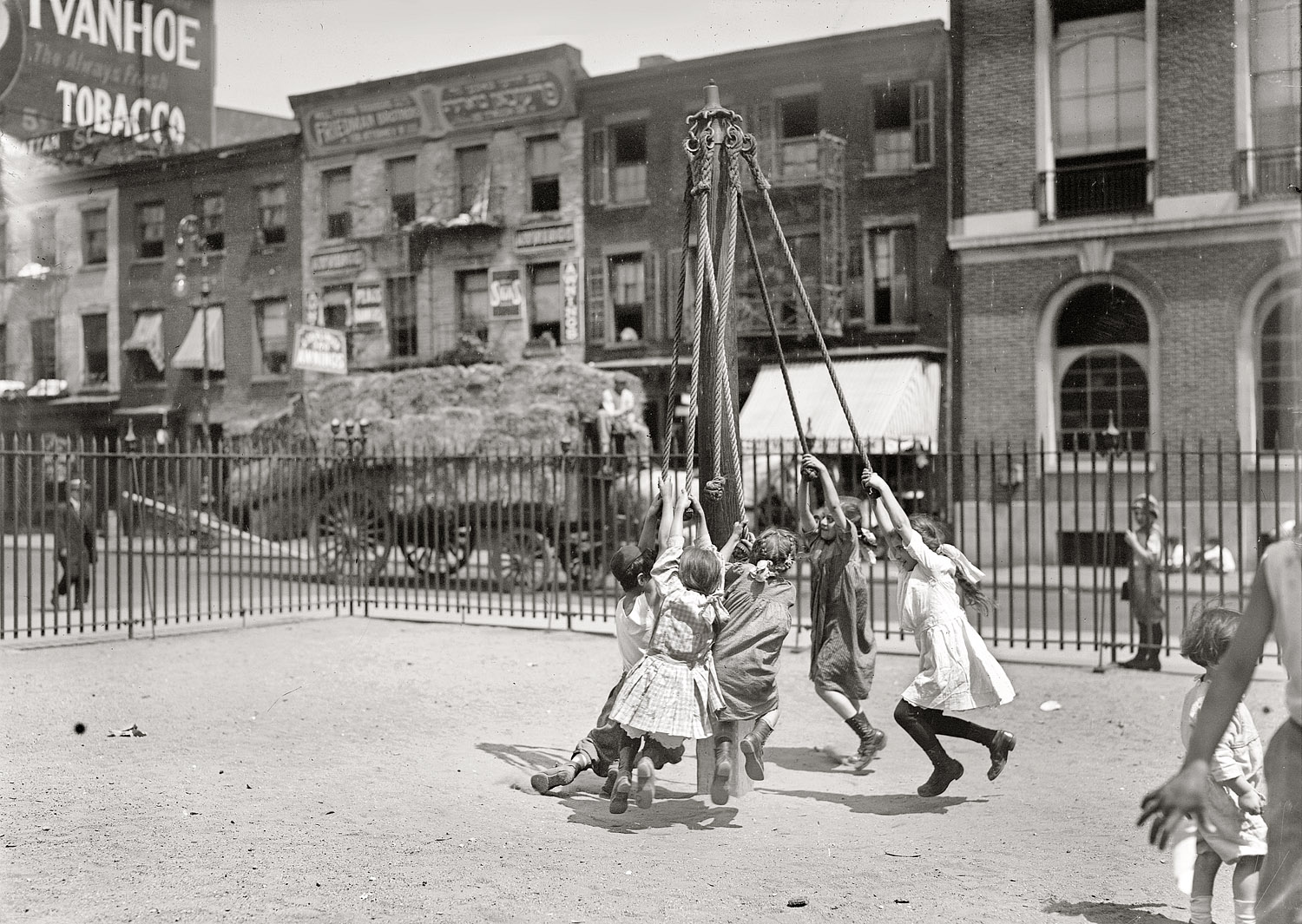 "N.Y. playground." Human tetherballs frolicking in East Side Manhattan circa 1910. 5x7 glass negative, George Grantham Bain Collection. View full size.