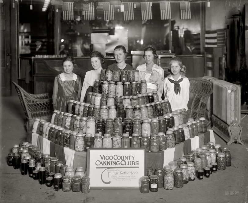 Circa 1918. "National War Garden Commission. Vigo County Canning Clubs." Indiana "farmerettes" at a War Garden exhibit in Washington. View full size.
