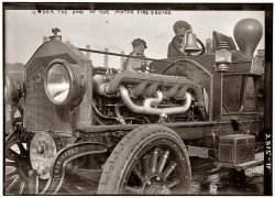 "Under the hood of the motor fire engine" with the New York Fire Department circa 1913. View full size. 5x7 glass negative, George Grantham Bain Collection. The truck seems to be a Robinson. What's the big bulby thing?