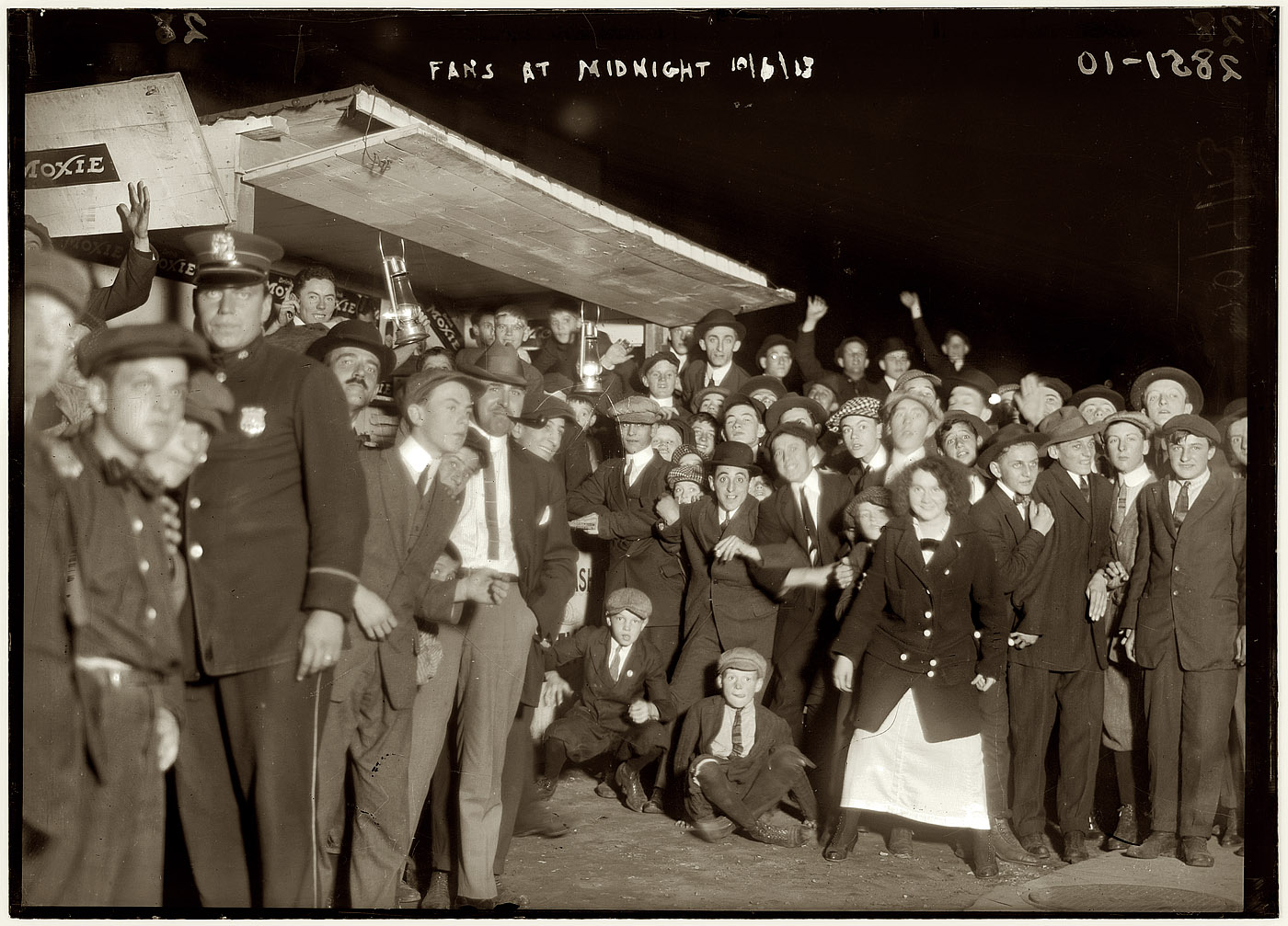 October 6, 1913. "Fans at Midnight." The crowd at a Moxie stand outside New York's Polo Grounds before the first game of the 1913 World Series between the Giants and Philadelphia Athletics the following afternoon. View full size.