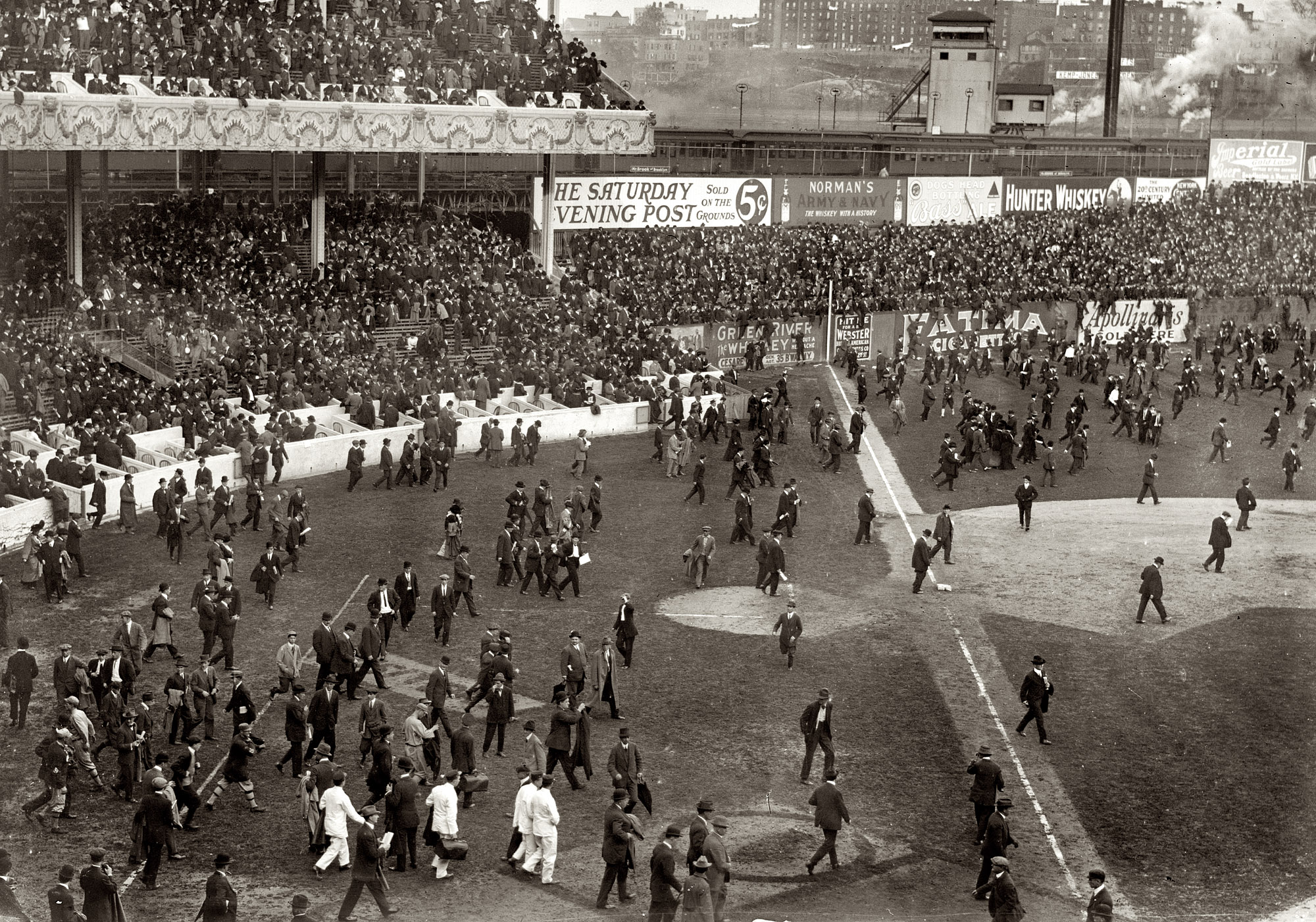 October 9, 1913. The scene at the Polo Grounds in New York after the third game of the World Series. Philadelphia Athletics 8, New York Giants 2. View full size. 5x7 glass negative, George Grantham Bain Collection.