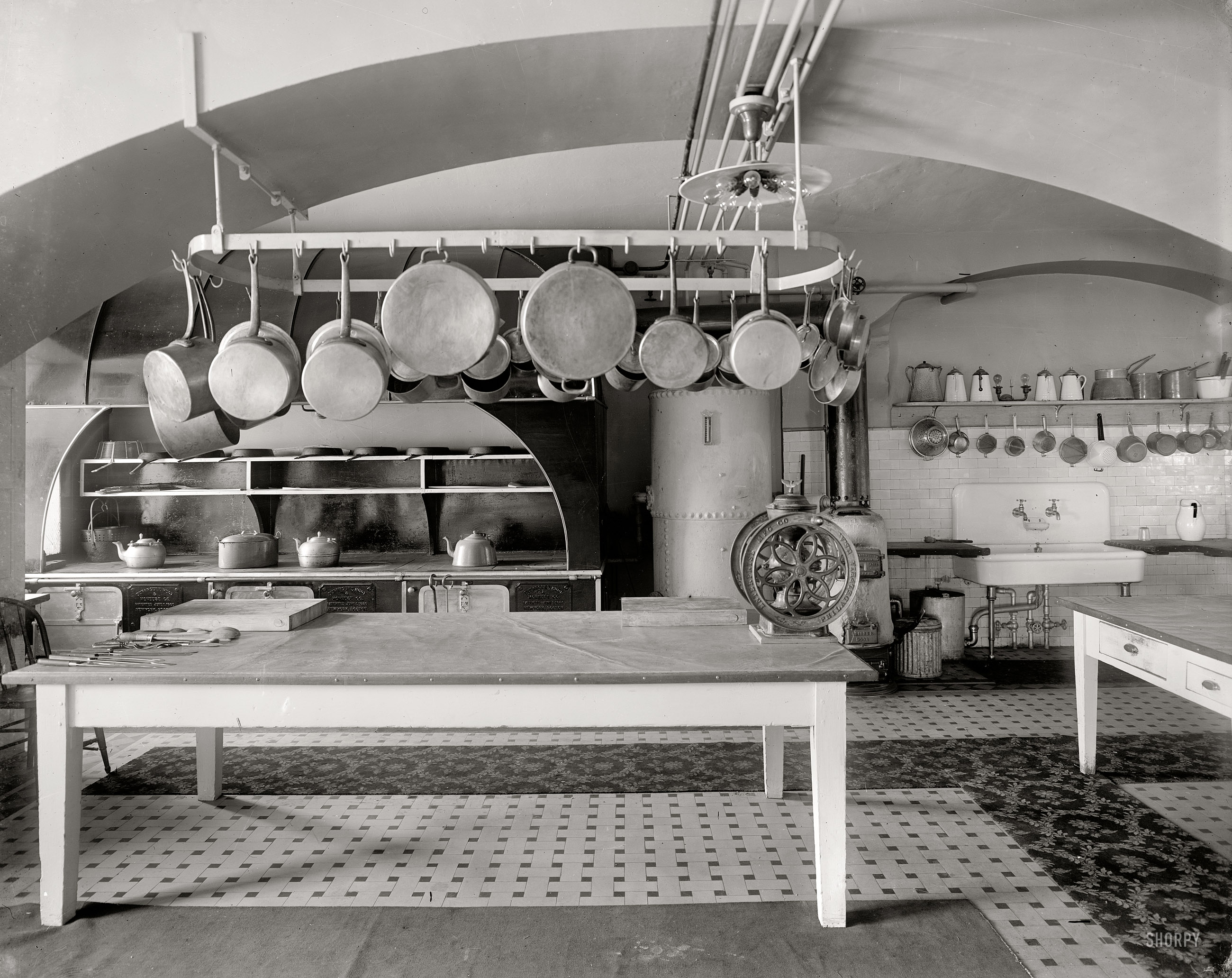 The White House kitchen circa 1909. Note the high-tech light fixture. Harris & Ewing Collection glass negative, Library of Congress. View full size.