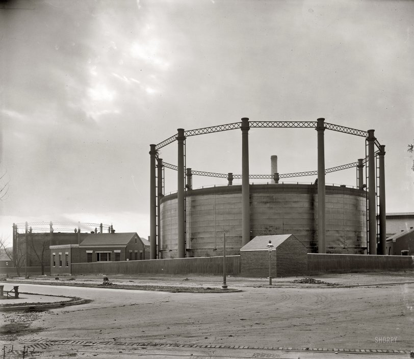 "Gas tank at 26th &amp; G." The city gas house and holding tanks ("gasometers") in Northwest Washington near the current location of the Watergate complex. The intersection in the photo (seen earlier here) is New Hampshire (middle left) and Virginia avenues. Harris &amp; Ewing Collection glass negative. View full size.
