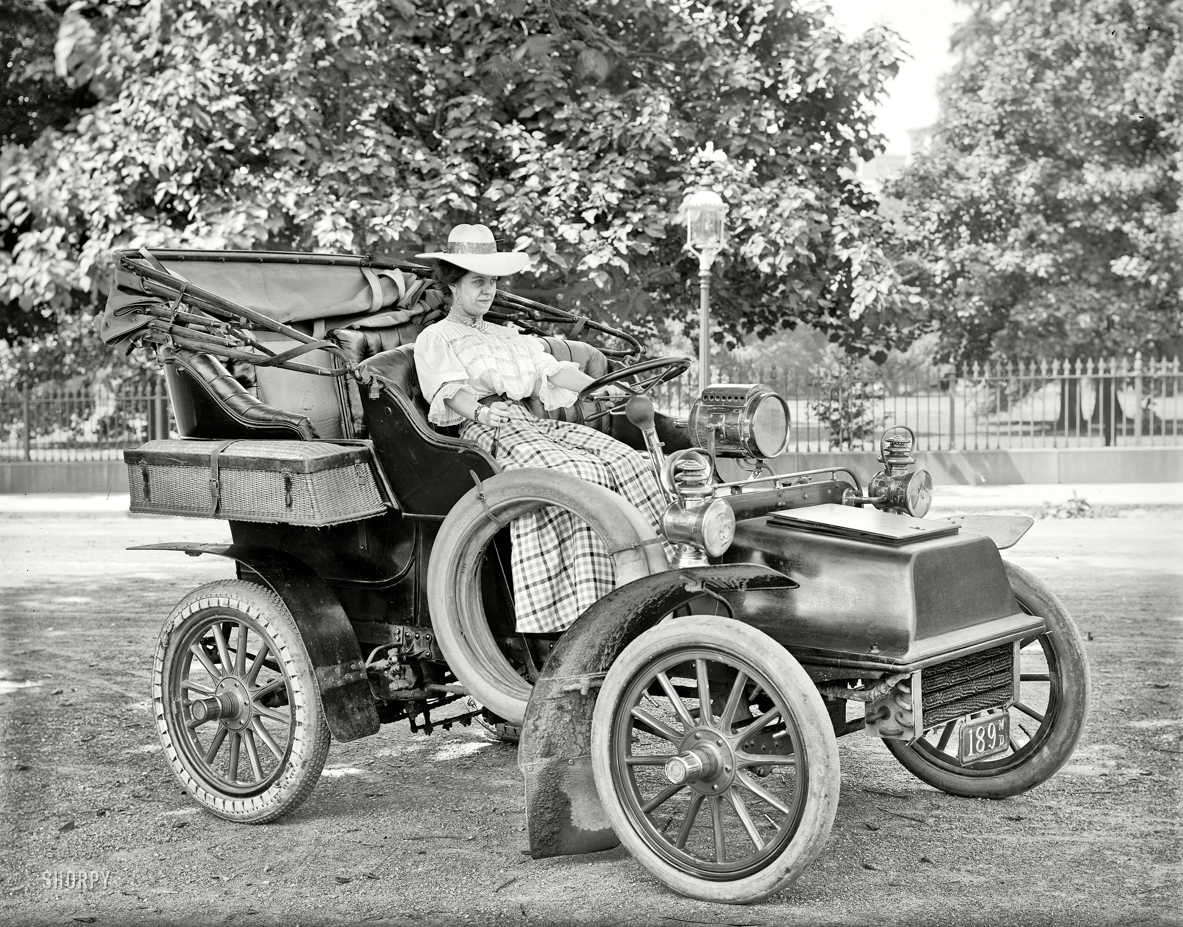 Washington, D.C., circa 1908. "Miss Corine Murphy in auto." Note the unusual rear tire. Harris & Ewing Collection glass negative. View full size.