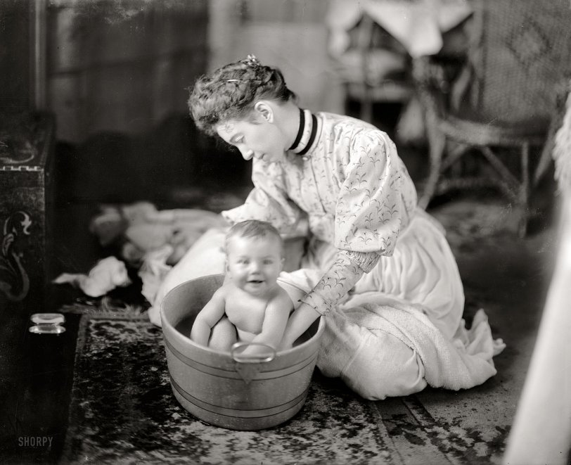 Circa 1905. "Martha Harris. Baby being washed." Maybe one (or two) of the Harrises of Harris &amp; Ewing. Harris &amp; Ewing glass negative. View full size.
