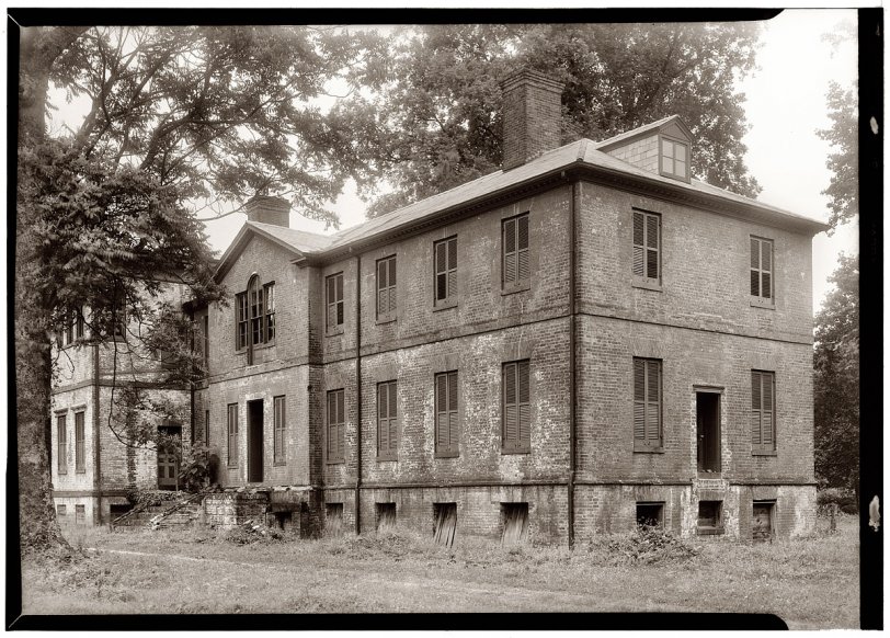 Main house at Elmwood, a pre-Revolutionary plantation in Essex County, Virginia, photographed in 1941 for the Historic American Buildings Survey. The 1852 Victorian stair tower to the left of the main entrance was removed in a 1950s restoration of the house, which was built around 1770. View full size. For a view of the house after it was restored click here.