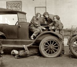 February 9, 1927. Central High School, Washington, D.C. "High school girls learn the art of automobile mechanics. Grace Hurd, Evelyn Harrison and Corinna DiJiulian, with Grace Wagner under the car." View full size. National Photo.