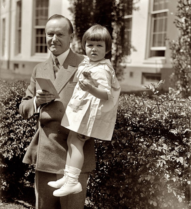 April 28, 1927. "Tiny tot gives President Coolidge flood relief contribution. Little Elizabeth Anne Stitt, daughter of Theodore Stitt, Commander-in-Chief of the Veterans of Foreign Wars, presents Mr. Coolidge with the first 'buddy' poppy of the season." View full size. National Photo Company Collection.
