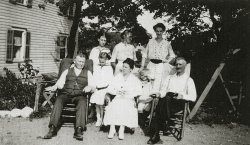 Tappan, New York, 1925. My grandmother, the tall person second row on the right, with her father in front of her, her father-in-law on the left front row and her mother-in-law  in the center. Her mother is to her right. The other two girls are her sisters. The small boy is her nephew. View full size.
(ShorpyBlog, Member Gallery)